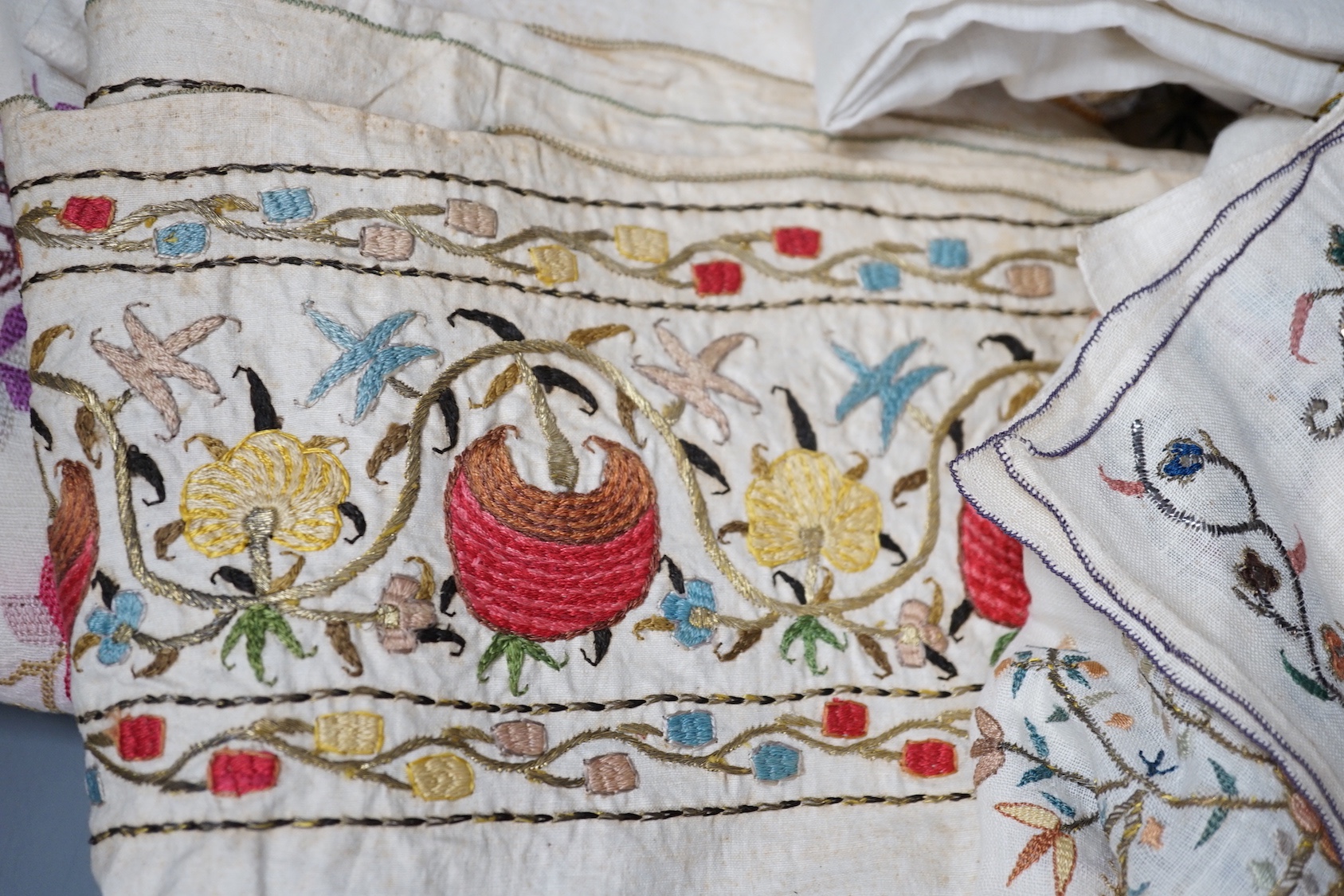 A collection of 19th century Turkish towels and runners, etc., embroidered with gold and silver and polychrome threads